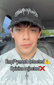 a young man wearing a hat and a necklace says employment detected