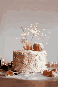 a cake with sparklers on top of it is on a table