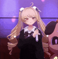a girl with blonde hair and red eyes is holding a microphone in front of a stuffed animal .