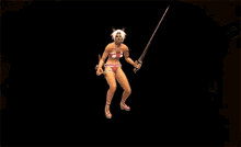 a woman in a bikini is holding a sword in her hand in a video game .