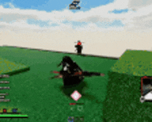 a blurry picture of a video game with a person laying on the grass .
