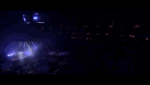 a person is playing a keyboard with a purple light behind them