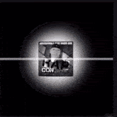 a black and white cube that says con on it