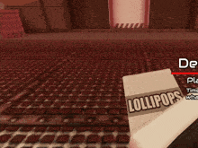 a box of lollipops sits on a brick floor