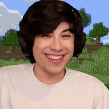 a man wearing headphones is smiling in front of a minecraft world