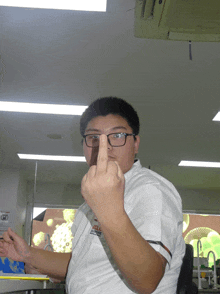 a man wearing glasses and a white shirt that says ' aol ' on it
