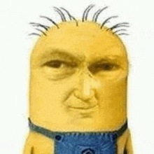 a close up of a yellow minion with a beard and a blue apron .