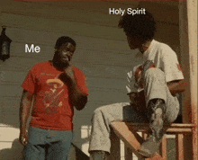a man in a red shirt is standing next to another man in a white shirt with the words holy spirit on the bottom