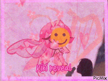 a drawing of a fairy with a smiley face and the words kiki reveal on the bottom