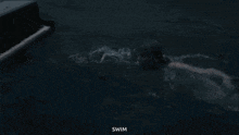 a person is playing a piano while swimming in the water .