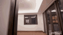an empty room with the words made in animotica on the bottom left