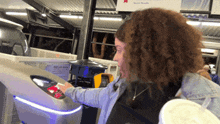 a woman is using a machine that says do you know