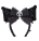 a pair of black bow ties with a skull on them on a white background .