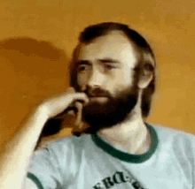 Phil Collins Hmm GIF - Phil Collins Hmm Idk GIFs