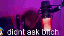 a person is sitting in front of a microphone with the words didnt ask bitch on the bottom