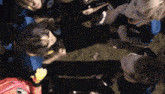 a group of people in a huddle with one wearing a jersey that says ' a ' on it