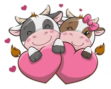 two cows are hugging pink hearts and smiling .