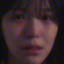 a close up of a woman 's face with a grid pattern .
