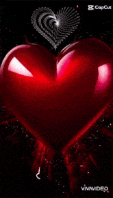 a couple is sleeping in a heart shaped pillow .