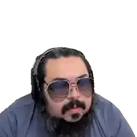a man with a beard and sunglasses is sticking his tongue out
