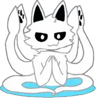a white cat with black ears and paws is sitting on a blue cushion