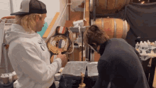 two men are looking at a boxing belt that says champions on it