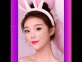a woman wearing bunny ears and a cat face paint .