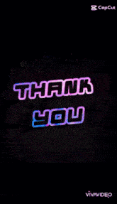 a neon sign that says thank you in pink letters