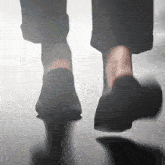 a person 's feet are visible in a blurry photo