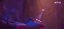 a close up of a person 's hand holding a bottle of water .