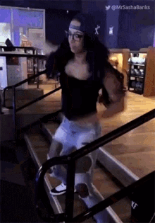 a woman is dancing on a set of stairs with the hashtag mrsashabanks at the top