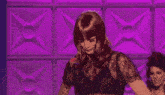 a pixel art of a drag queen with a purple background