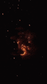 a close up of a yellow and red explosion in space