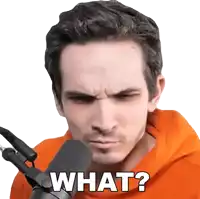 a man in an orange hoodie is talking into a microphone and asking what