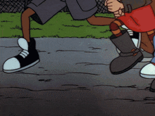 a close up of a cartoon character 's feet with red sneakers