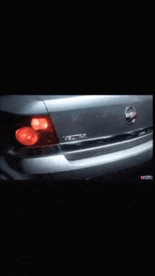 a close up of a nissan car with a black background