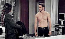a shirtless man is standing next to a woman who is asking him what he is doing here