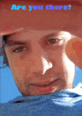 a close up of a man 's face with the words " are you there " on the bottom