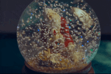 A Snowglobe With Santa In It The Holdovers GIF - A Snowglobe With Santa In It The Holdovers Christmas GIFs