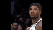a basketball player wearing a jersey that says ' ny ' on it