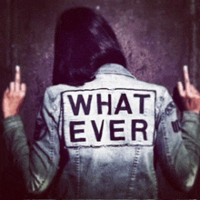 a woman wearing a jacket that says what ever