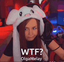 a woman wearing a bunny hat with the words wtf along the bottom