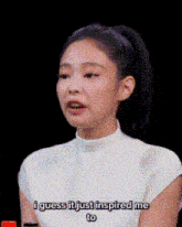 a woman in a white shirt is saying i guess it just inspired me to