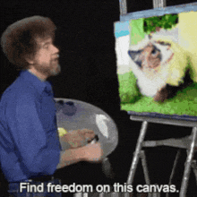 bob ross says find freedom on this canvas while painting a picture of a cat