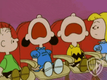 a group of peanuts characters sitting in red chairs with their mouths wide open