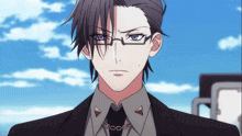 a man with glasses and a chain around his neck is wearing a suit and tie