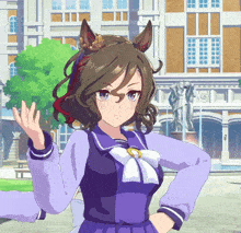 a girl with a horse 's ears is standing in front of a building and waving