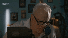 an older man is looking through a magnifying glass with the words son of a glitch behind him