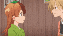 two anime girls are looking at each other and one has a leaf on her head .