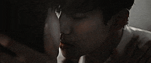 a close up of a man 's face with water coming out of his nose and mouth .